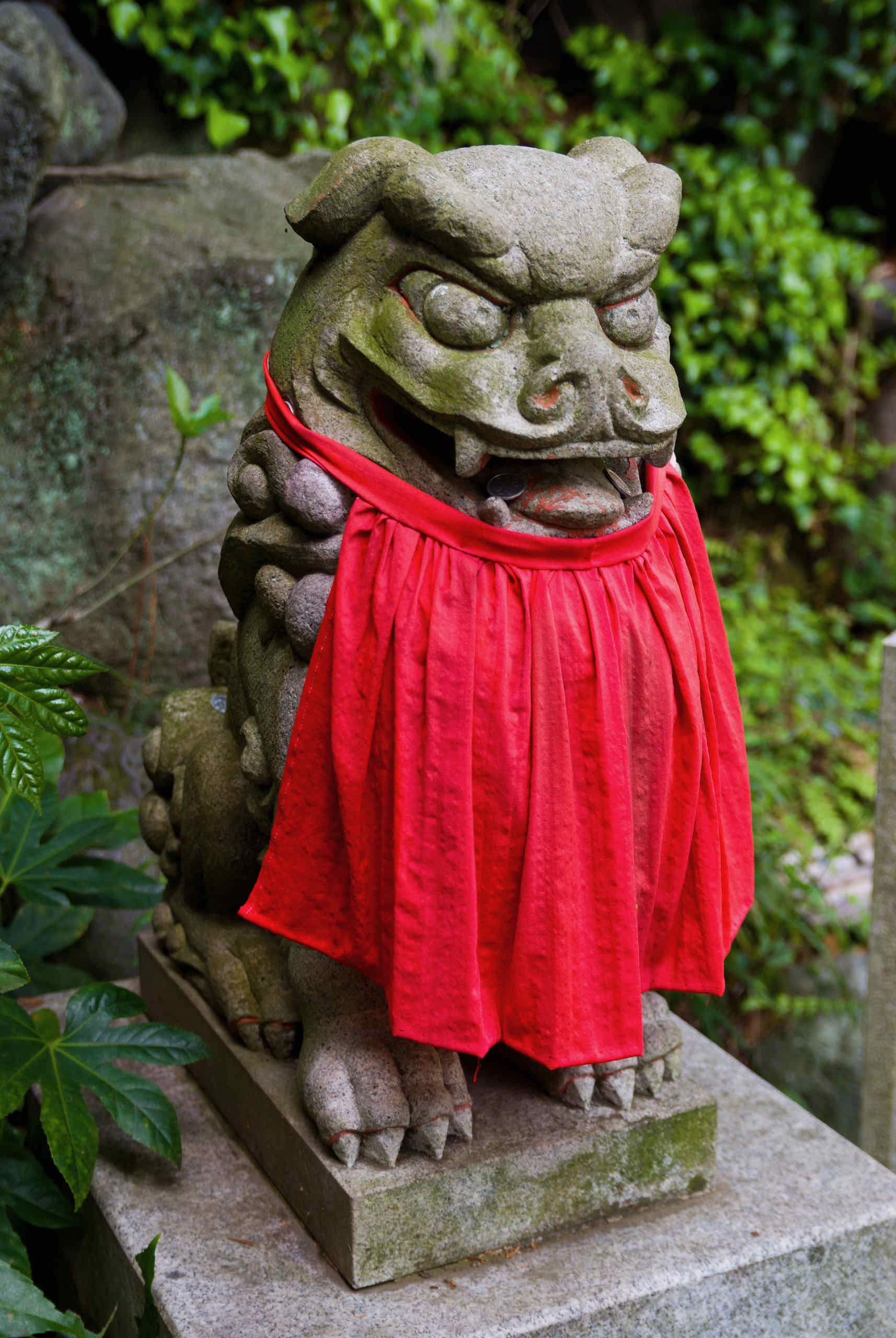 lion statue with red diaper